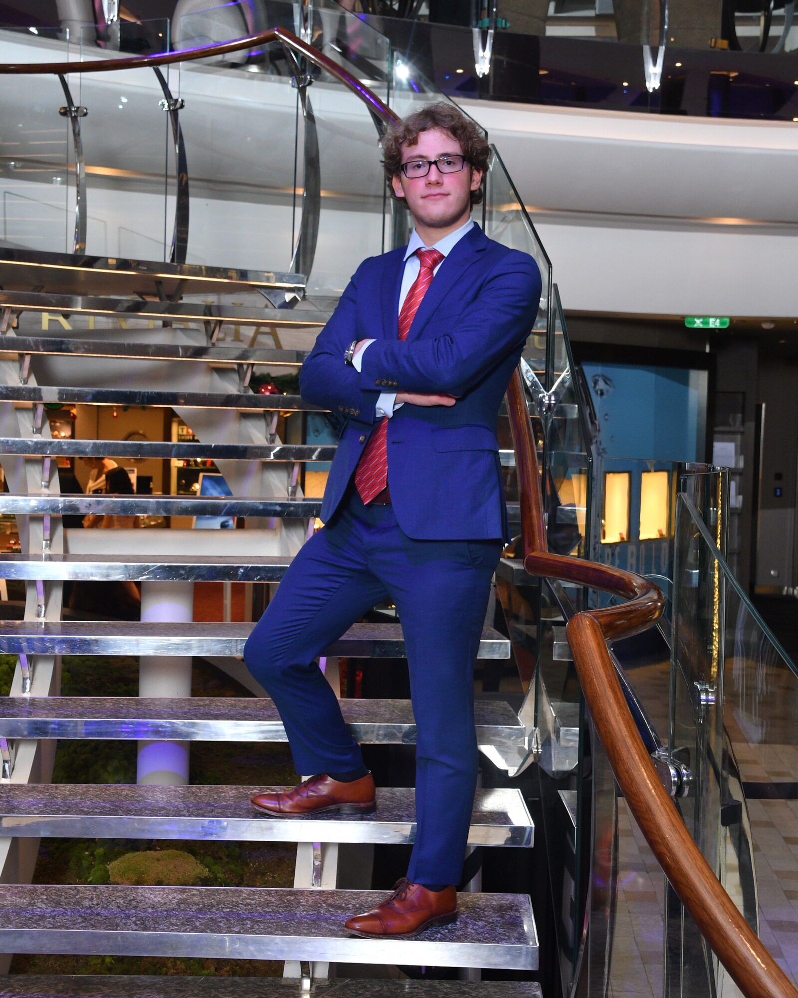 Jacob Citron on the stairs during a cruise